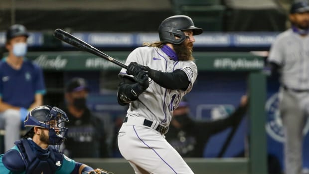 Aug 7, 2020; Seattle, Washington, USA; Colorado Rockies right fielder Charlie Blackmon (19) hits a single against the Seattle Mariners during the third inning at T-Mobile Park. Mandatory Credit: Joe Nicholson-USA TODAY Sports